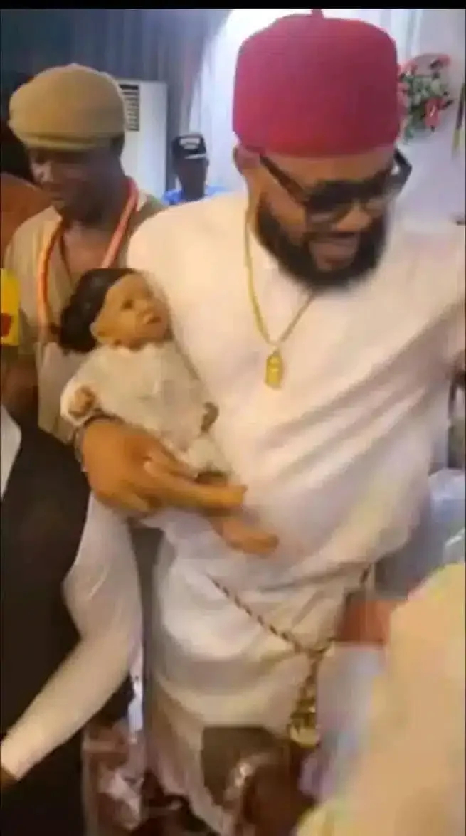 Couple reportedly uses doll baby to stand in for their daughter during celebration