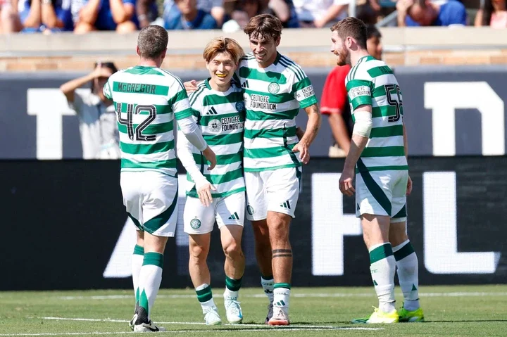 Celtic's forward #8 Kyogo Furuhashi (2nd L) celebrates with teammates after scoring a goal during the pre-season club friendly football match betwe...