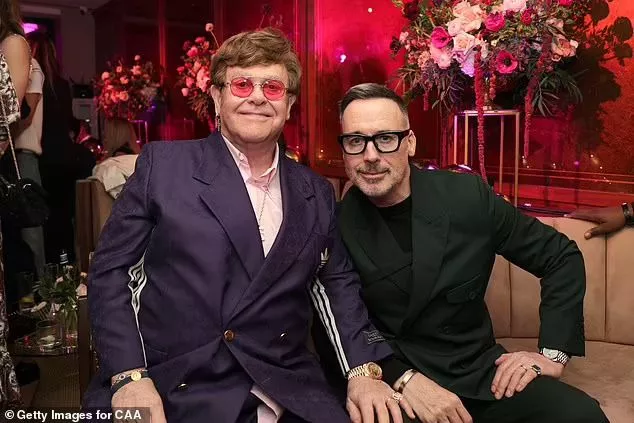 Emotional David, who wed the Rocket Man singer in 2014, pictured with Sir Elton