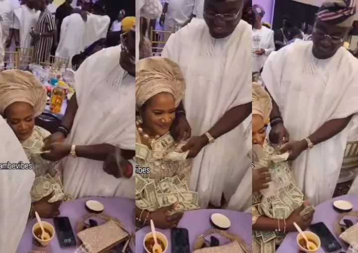 Mercy Aigbe's husband, Kazim Adeoti's first wife, Funsho, looks unbothered as he sprays her at a party in the US (video)