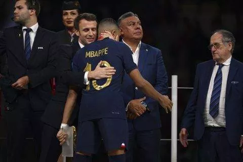 French president Emmanuel Macron embracing Kylian Mbappe -- Image credit: Imago