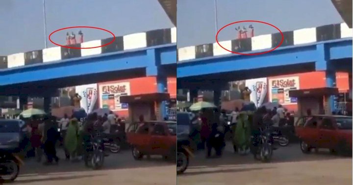Three men on red wrapper caught on camera taking their bath on a bridge in Ibadan (Video)