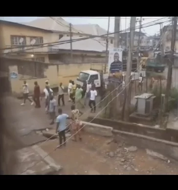 Thugs walk streets of Fadeyi chanting "If you no vote APC no come outside" (video)