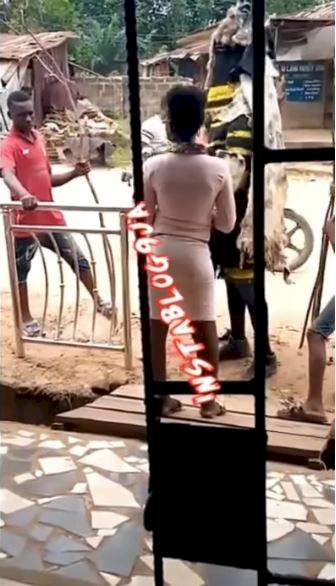 Somebody's god found her - Reactions as masquerade is spotted wooing a lady (Video)