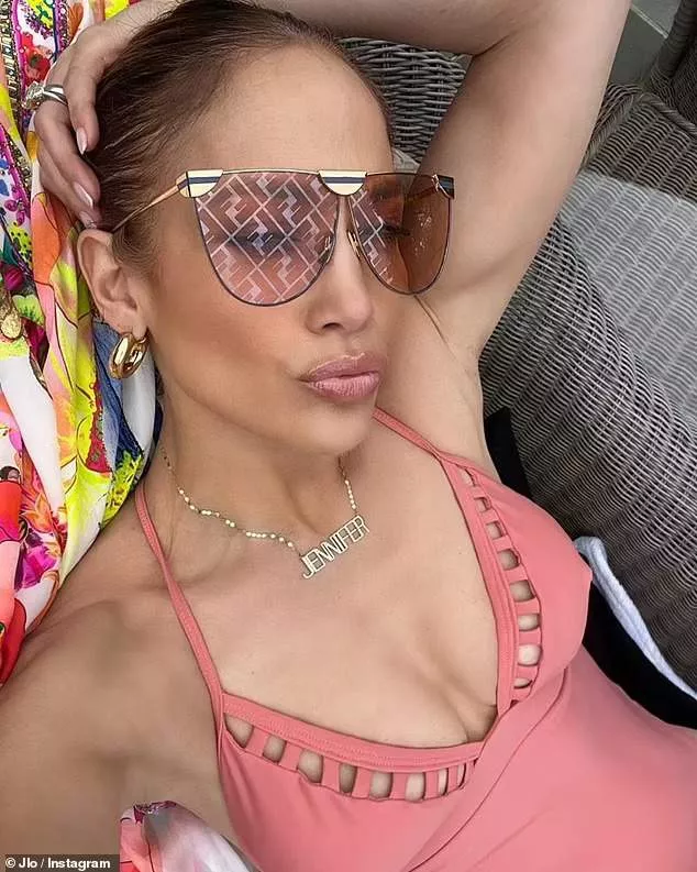 Actress Jennifer Lopez, 53, showcases her famous derriere in plunging swimsuit (photos)