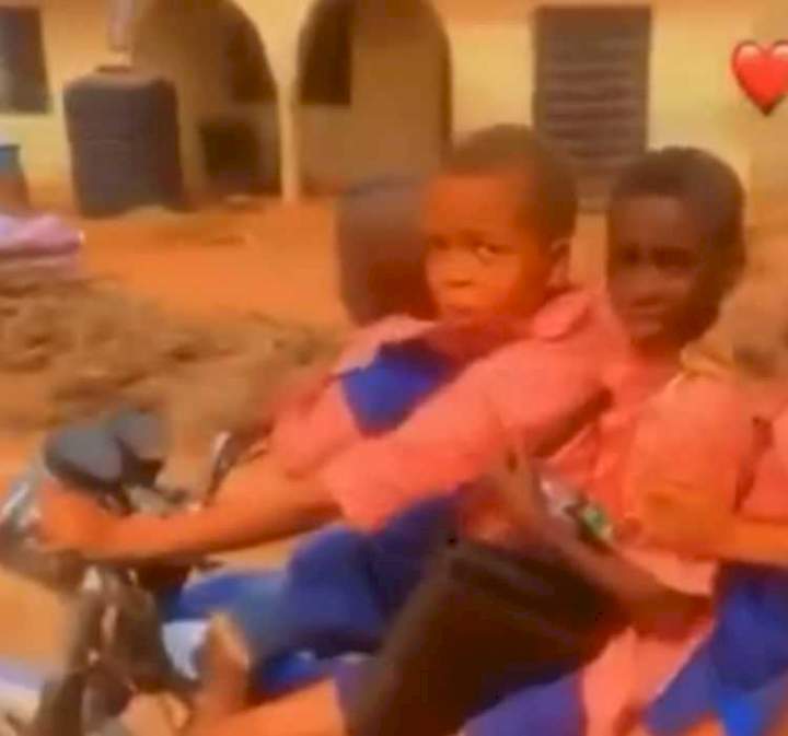 Young boy transporting four other kids on bike triggers outrage (Video)