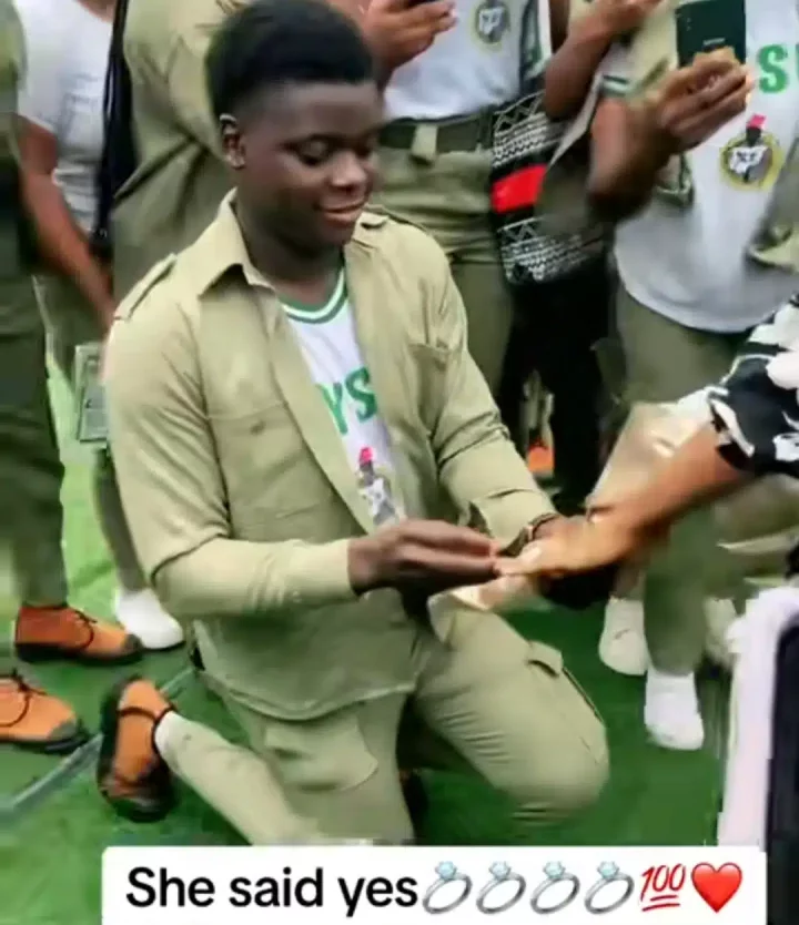 Congratulations pour in as corps member proposes to girlfriend, sprays money during passing out parade