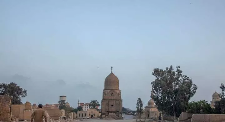 A man looks at graves demolished to make way for a new highway in Cairo, in 2020.Nariman El-Mofty/AP