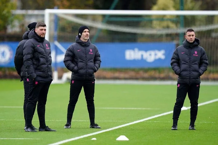 Chelsea manager Enzo Maresca with members of his coaching staff during a training session at Cobham Training Ground, London.