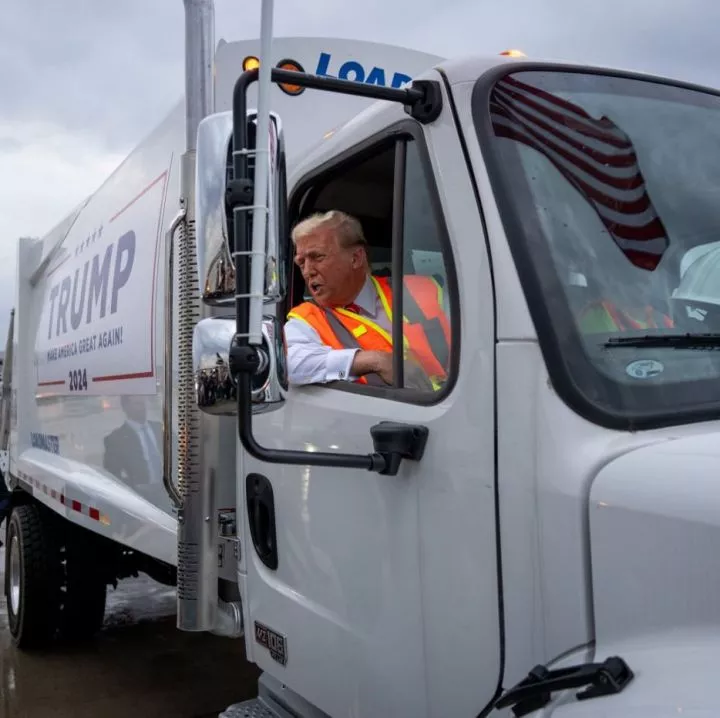 Trump rides garbage truck and wears garbage picker uniform to rally days after Biden called his supporters garbage (videos)