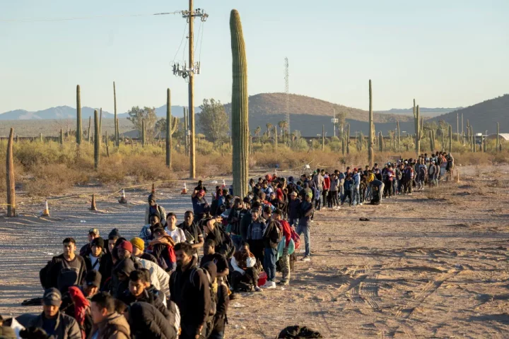 Migrants queueing at a U.S. border processing center in Arizona.