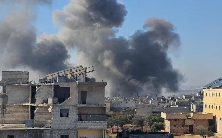 Damaged buildings in Daret Izzah after an attack by Russian warplanes