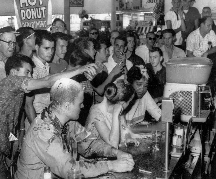 A Mob Pours Sugar, Ketchup And Mustard Over The Heads Of (From Left) John Salter, Joan Trumpauer And Anne Moody During A Sit-In Demonstration At A Woolworth's 'Whites Only' Lunch Counter In Jackson, Miss. - May 28, 1963. (Photo By Fred Blackwell/Associated Press)