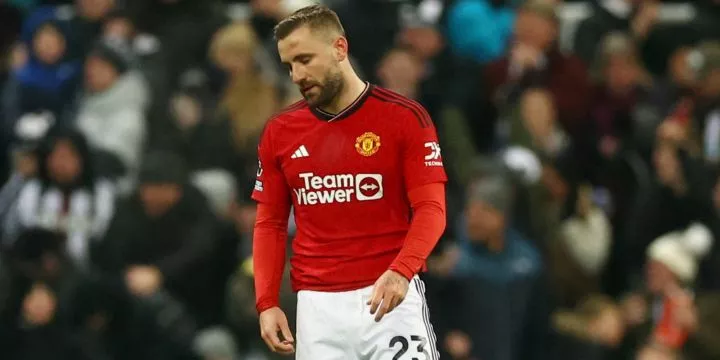 Luke Shaw looking distressed while playing for Manchester United