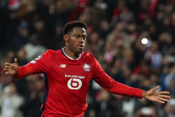 Jonathan David celebrates after scoring for Lille against Real Madrid.