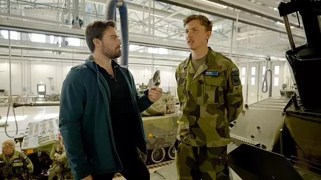 Gotland is increasing the number of conscripts it trains each year as the country ramps up militarisation. MailOnline's Chief Foreign Reporter David Averre is pictured speaking with a conscript named Ivar
