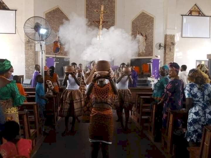 Reactions pour in as photos from a Catholic church in Abuja celebrating mass using African cultural items surface online