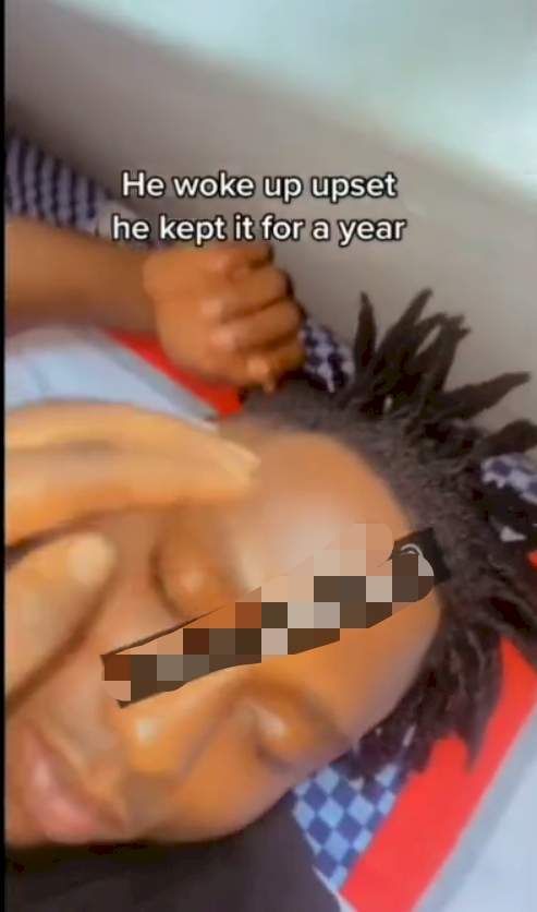 "This one na 9ja Delilah" - Reactions as lady cuts her boyfriend's dreadlock while he was sleeping (Video)