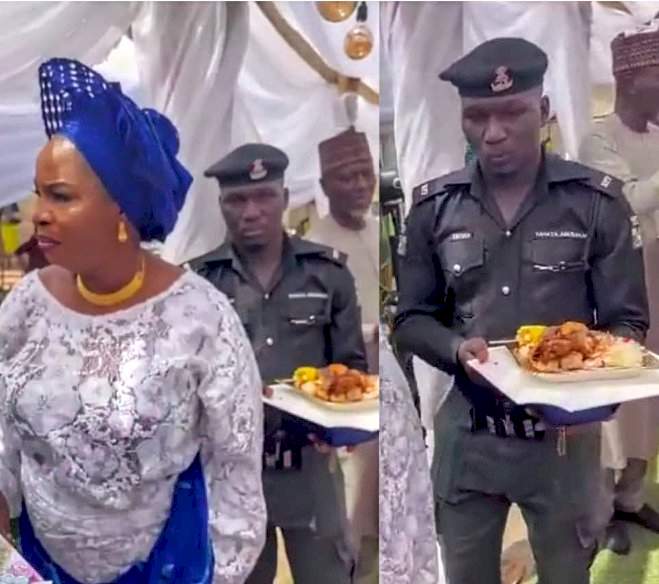 Moment police officer held a plate of food for his madam at a party stirs reactions (Video)