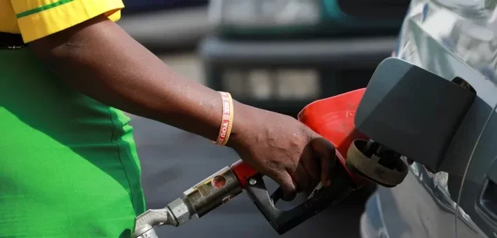 A gas station attendant pumps fuel into a customer's car at the NNPC Mega petrol station in Abuja, Nigeria March 19, 2020. REUTERS/Afolabi Sotunde