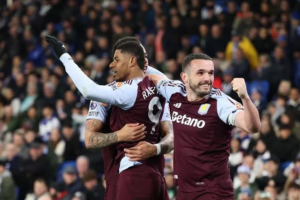 John McGinn celebrates with Marcus Rashford during Aston Villa's victory over Brighton and Hove Albion