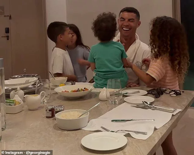 Cristiano Ronaldo, 29, looked in high spirits following Portugal's devastating Euros loss (pictured: Cristiano with son Mateo and daughters Eva, Alana, and Bella