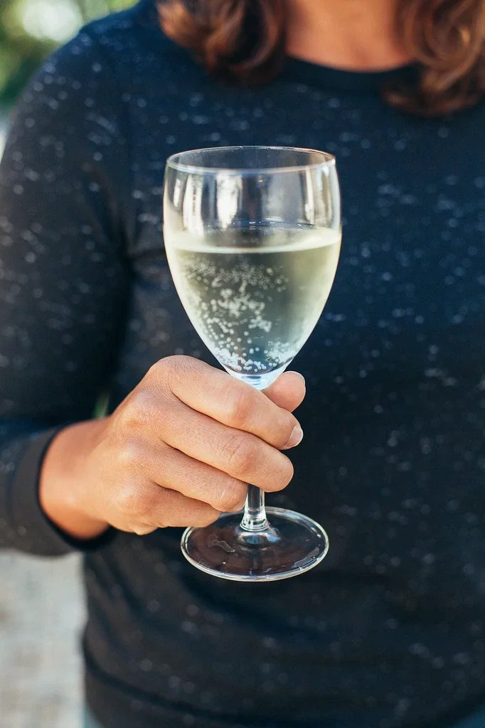 How to Hold a Wine Glass Properly & Why It Matters