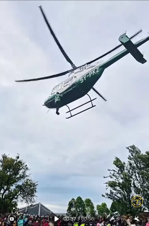 Shocking moment as man hangs onto helicopter mid-air