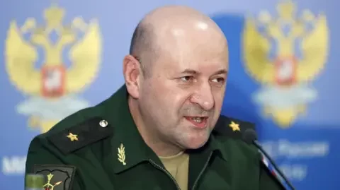 EPA Kirillov pictured wearing Army uniform and speaking at a news conference