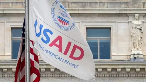 Getty Images A flag outside the USAID headquarters in Washington, DC