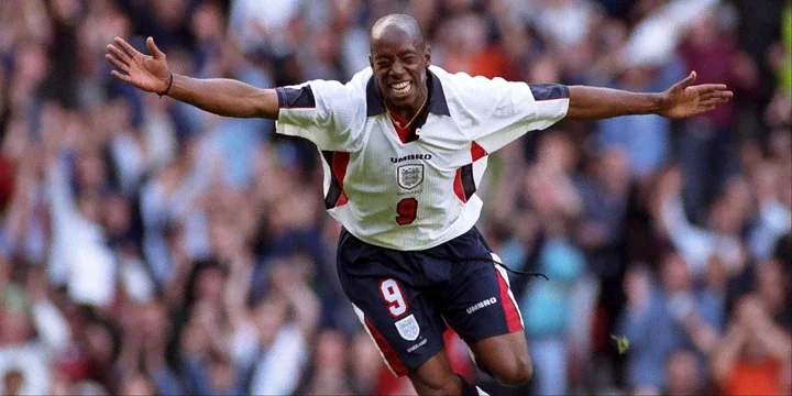 Ian Wright celebrates scoring for England