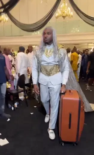 Pretty Mike stirs uproar as he storms Lagos event with luggage box carrying a lady