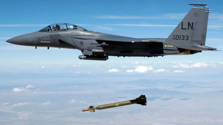 A U.S. Air Force F-15E Strike Eagle aircraft from the 492nd Fighter Squadron, Royal Air Force (RAF) Lakenheath, United Kingdom (UK) releases