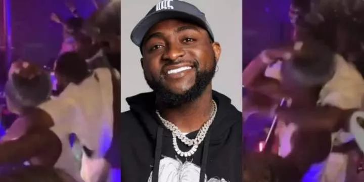 "OBO too like play" - Controversy erupts as Davido rough-handles Wizkid's neck at 'Evenintheday' event