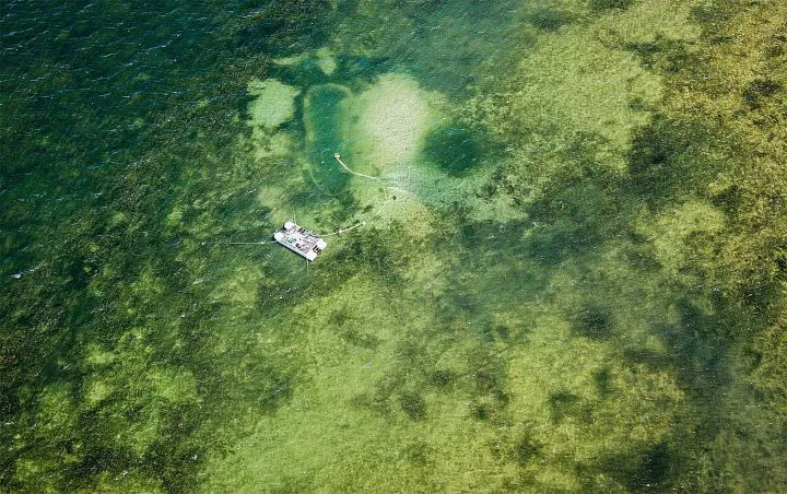 An aerial view of a research boat in water