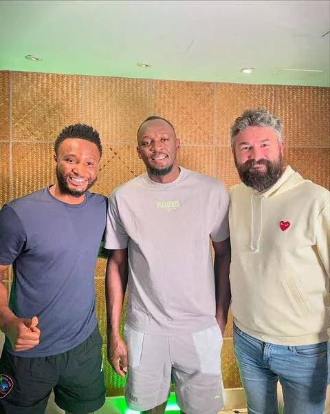 Bolt with the Obione Podcast crew led by Mikel Obi.