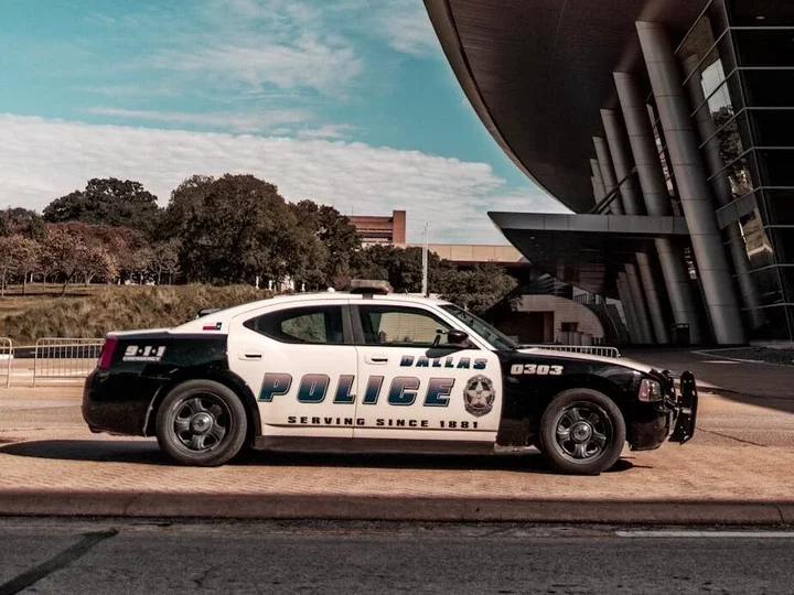 Police Car Parked Near Building