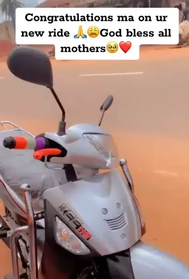 Mother overjoyed, rolls on floor as son surprises her with a brand-new motorcycle