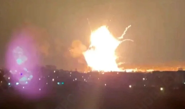 a large fireball is exploding in the night sky