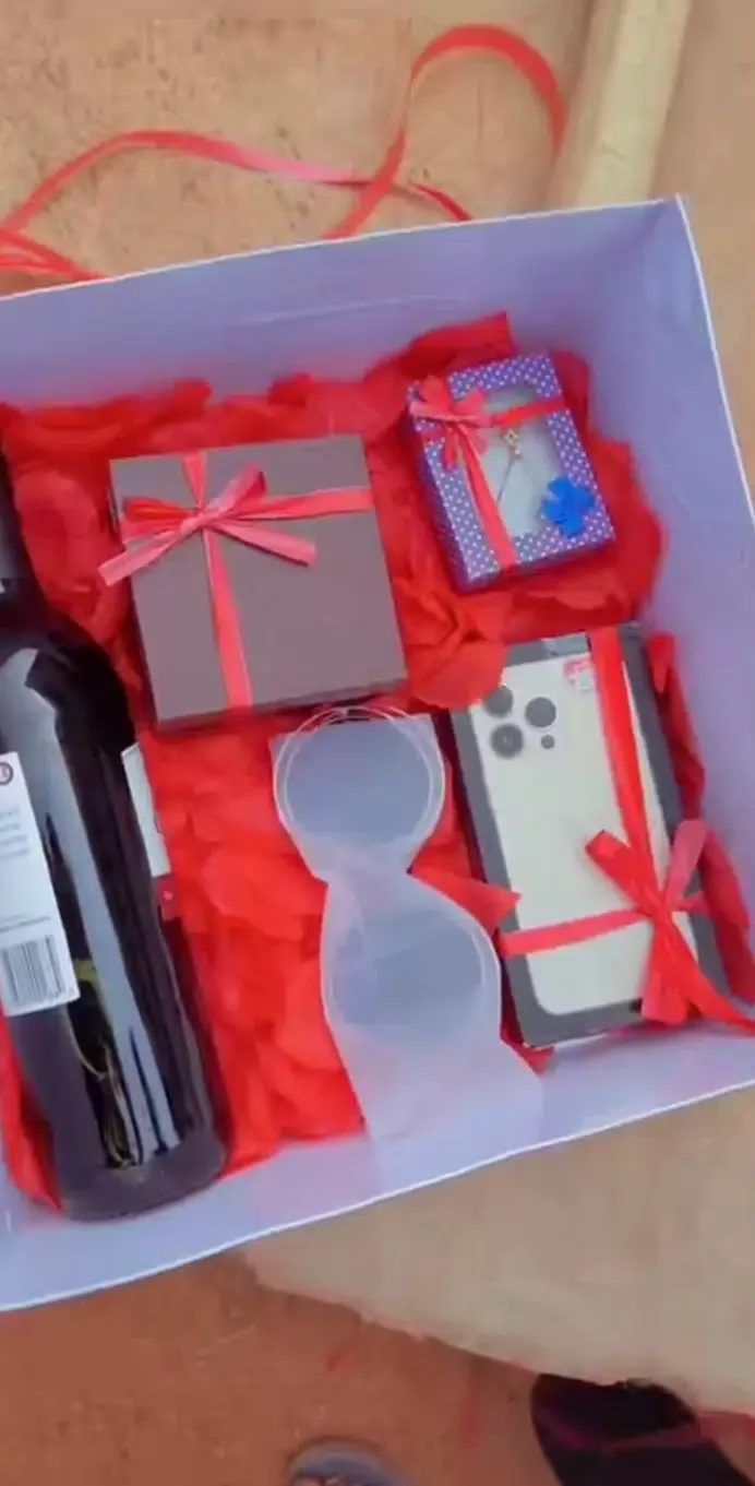 Nigerian man surprises girlfriend with iPhone 14, wigs, money bouquet on birthday (Video)