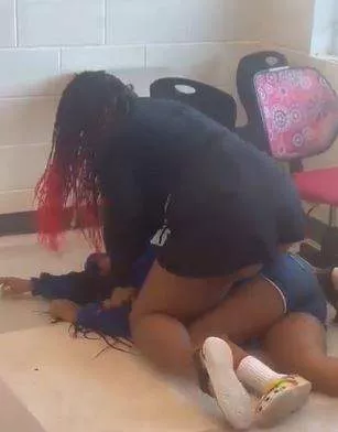 Female teacher beats up student for slapping her (Video)