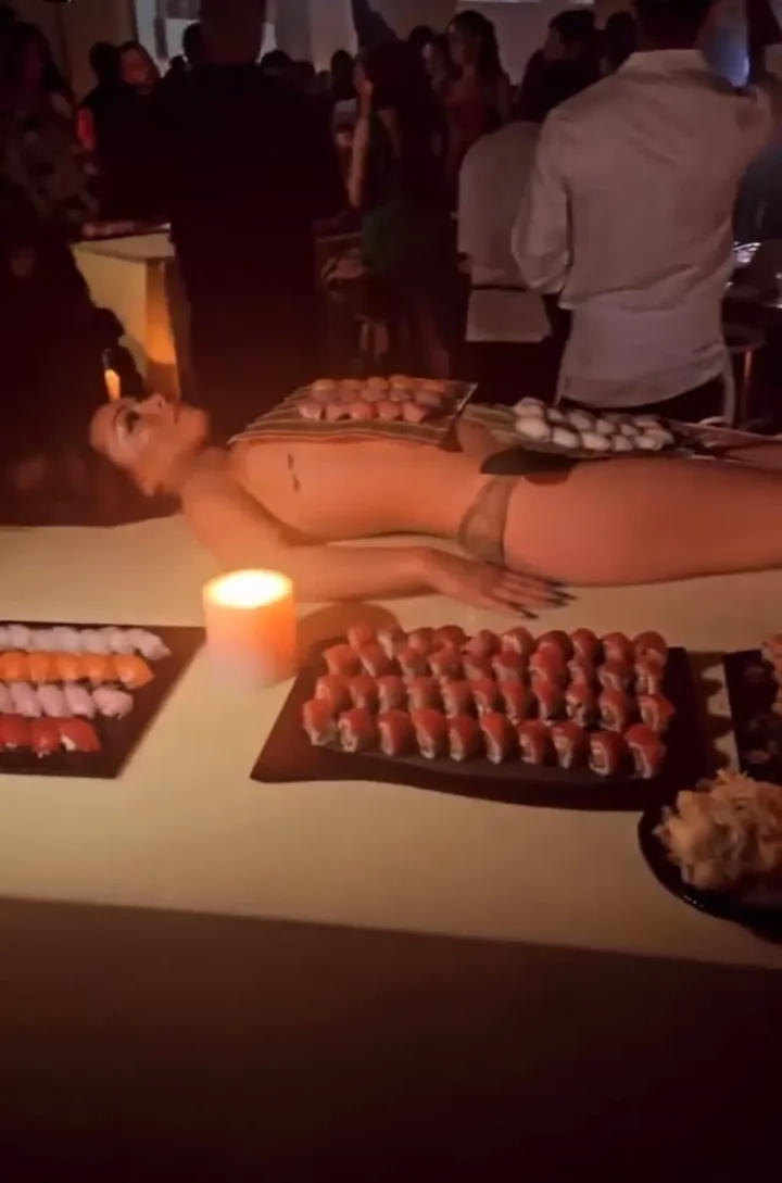 'Pastor Ye don backslide' - Mixed reactions as Kanye West marks birthday with Sushi served on unclad women (Video)