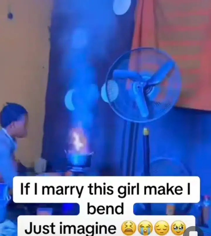 'If I marry this girl make I bend' - Man cries out as girlfriend sets pot on fire while cooking (Video)
