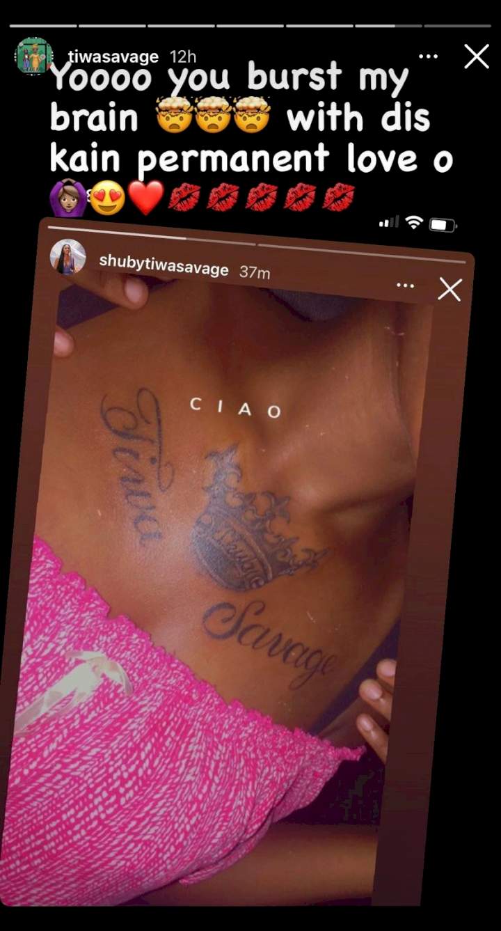 Tiwa Savage reacts as fan tattoos name on chest