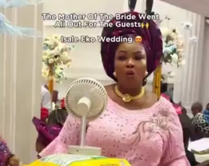 Mother of the bride distributes rice, gas cylinders, pots, and more in viral wedding video