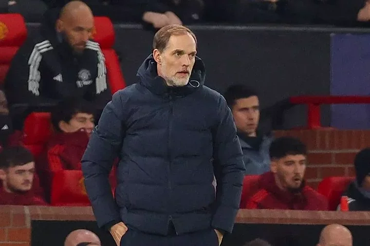 Tuchel in the Old Trafford away dugout as Ten Hag's old assistant Mitchell van der Gaag watches on