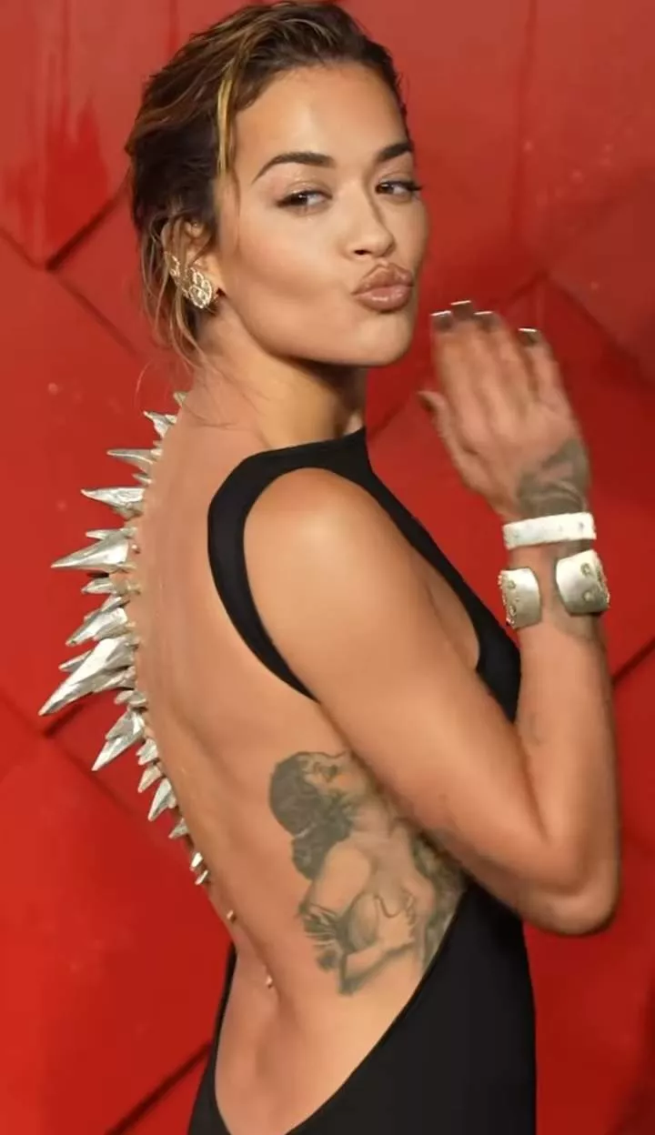 Rita Ora wears silver spikes down her back at the British Fashion Awards 2023 (photos/video)