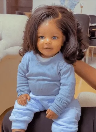 Mixed reactions trail video of cute baby girl wearing wig