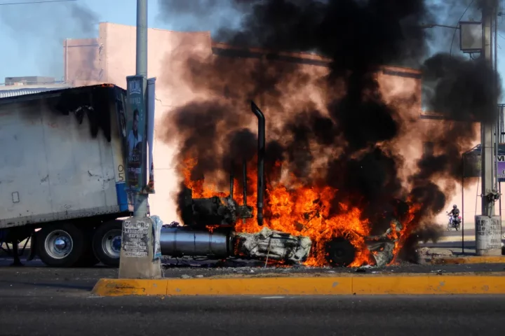 A truck burns on a street in Culiacan, Sinaloa state, during gang conflict