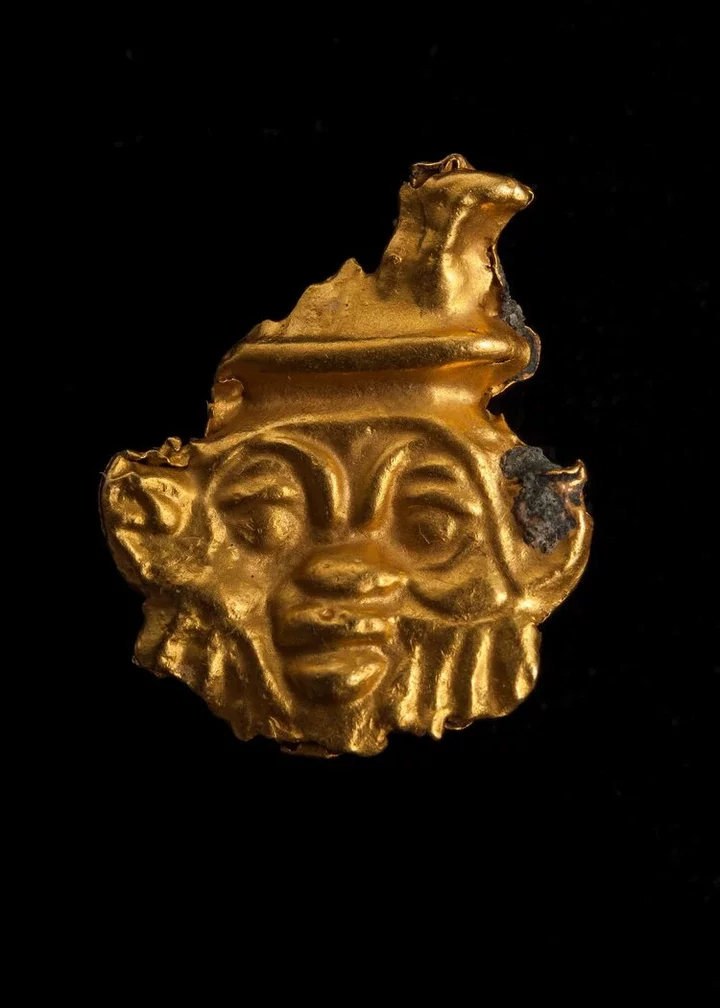 A gold amulet depicting Bes, an Egyptian god associated with childbirth and fertility